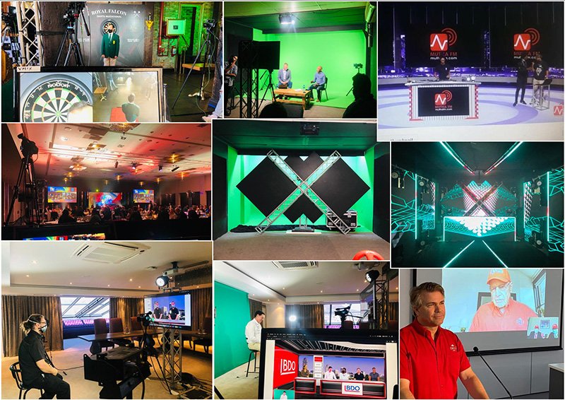 Technical crew operating live stream broadcast equipment at a live event